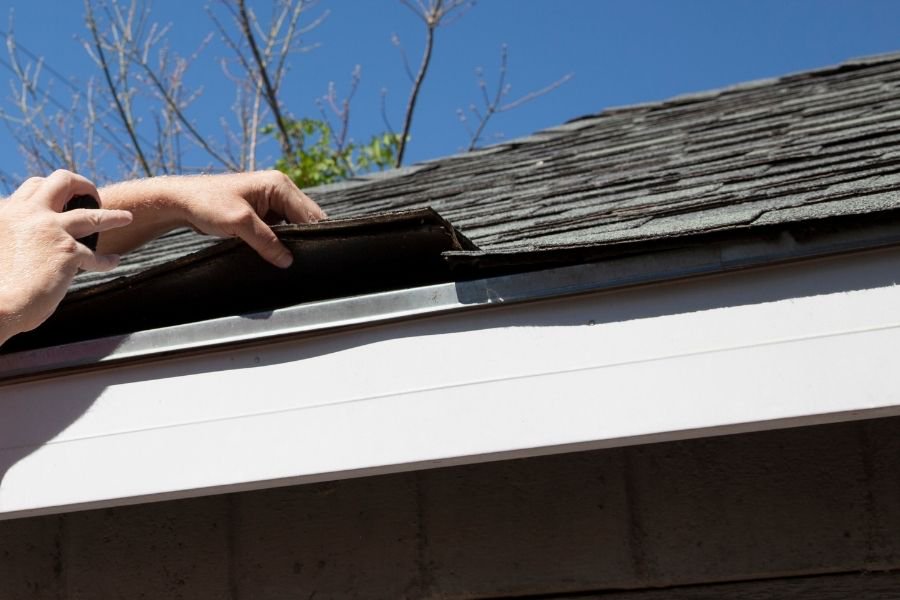 checking roof shingles