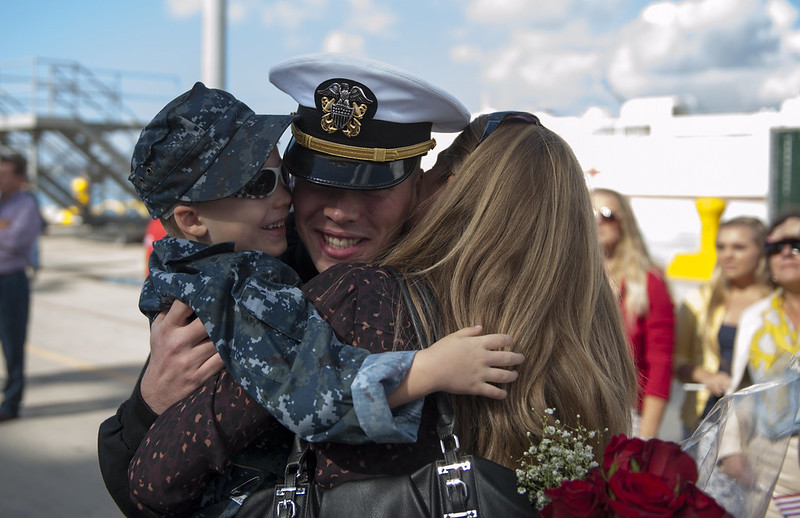 Navy man reuniting with family after deployment
