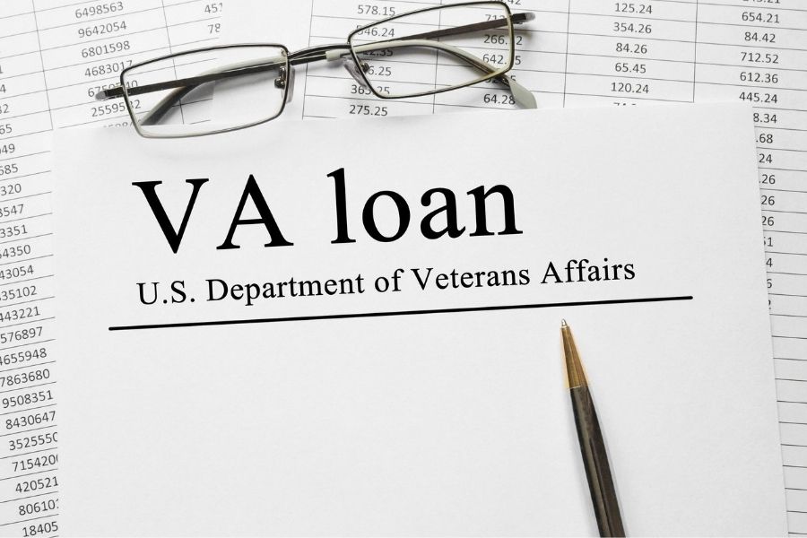 VA loan paperwork and glasses