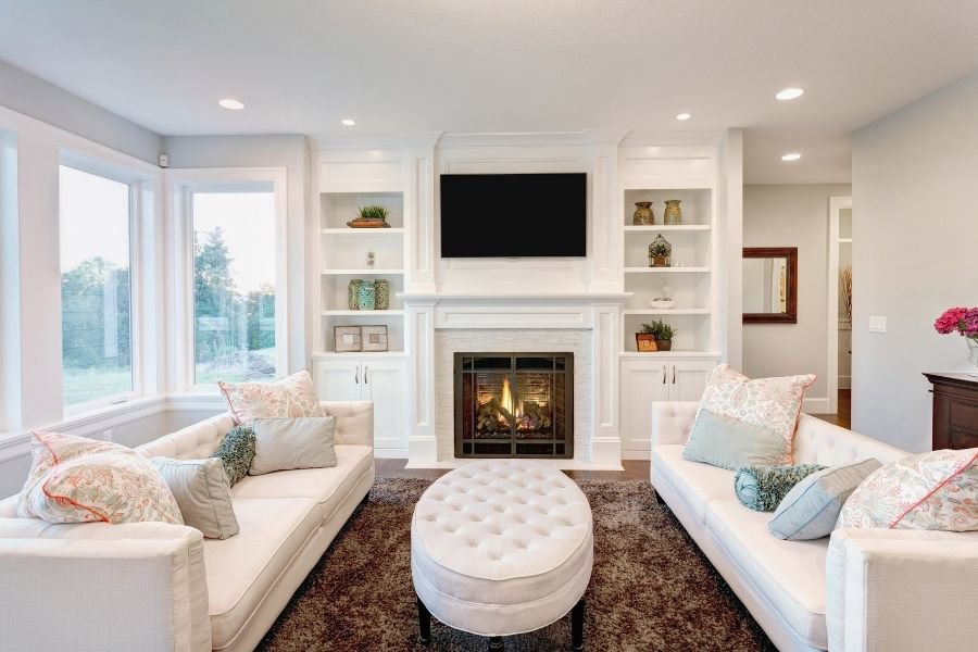 living room with couches and fireplace