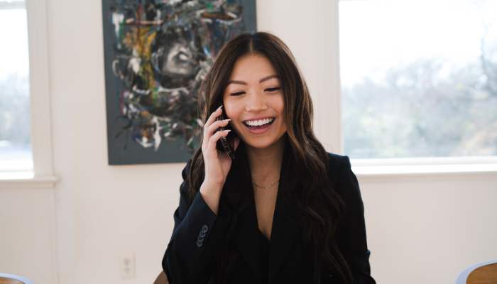 Woman chatting happily on phone