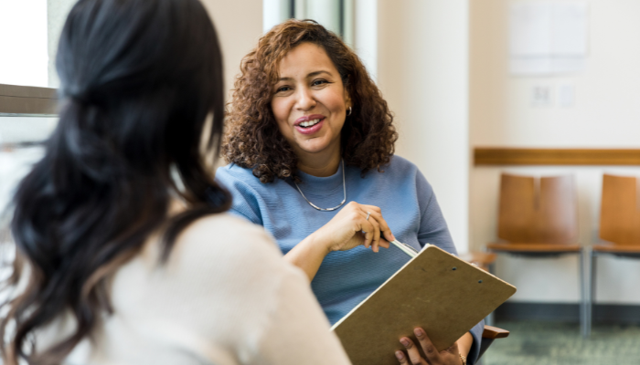 Woman interviewing potential property manager for rental home.