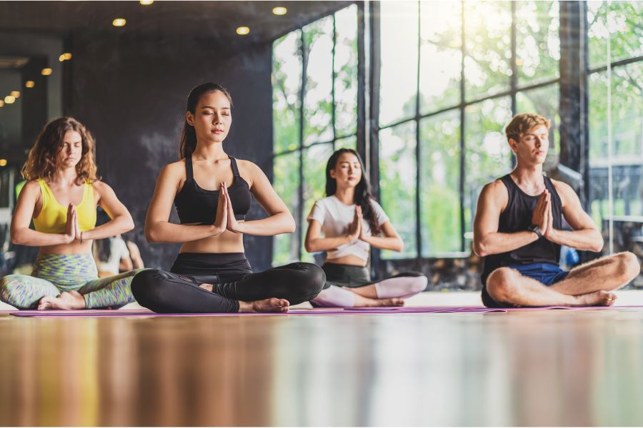 people doing yoga in studio