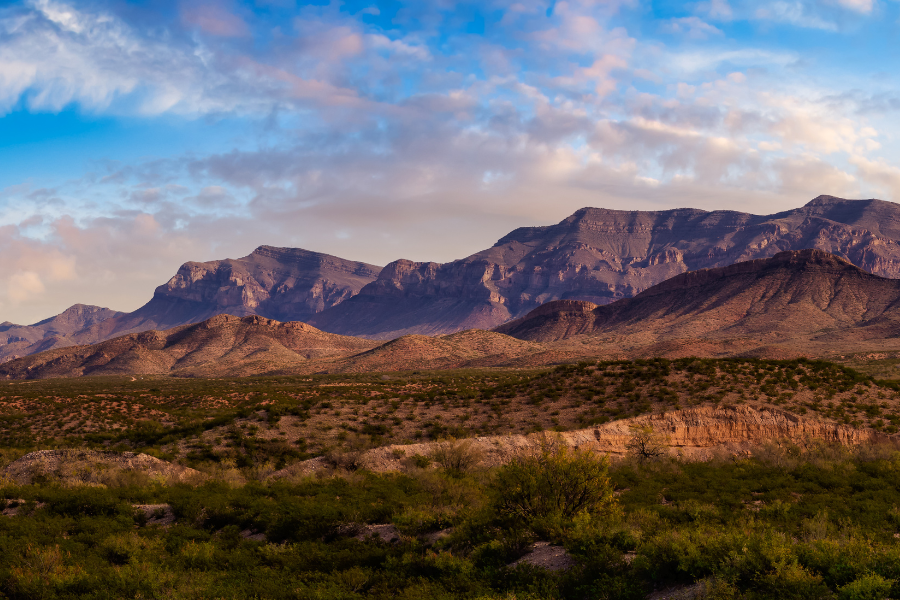 El Paso, TX near Fort Bliss - line of mountains with desert and blue sky and clouds