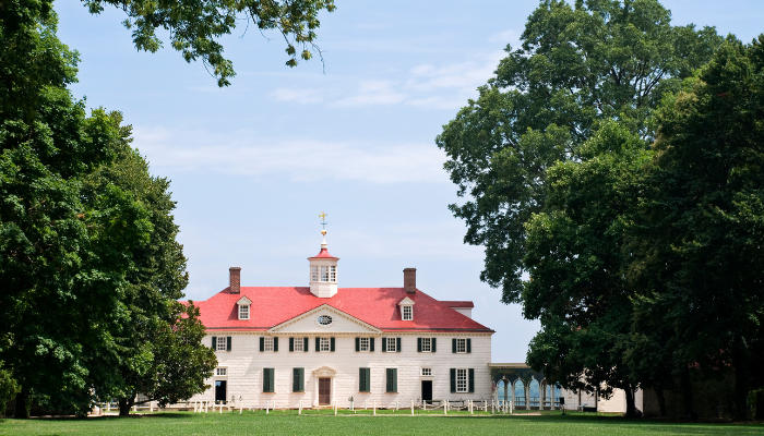Mount Vernon estate with bright green trees and lawn, historic buildings
