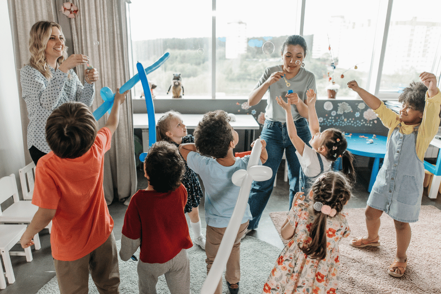preschool children playing with balloons