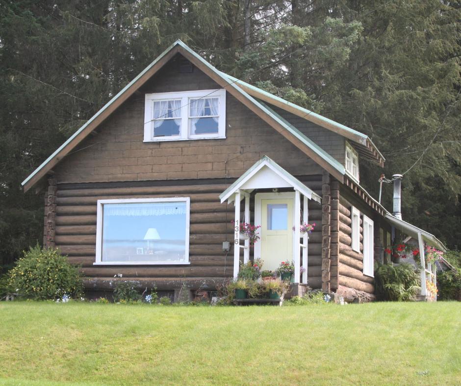 log home in Alaska surrounded by forest