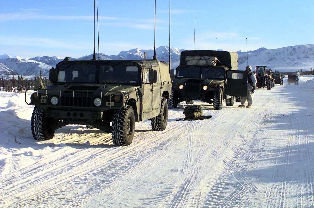 Fort_Greely caravan of military vehicles on snow