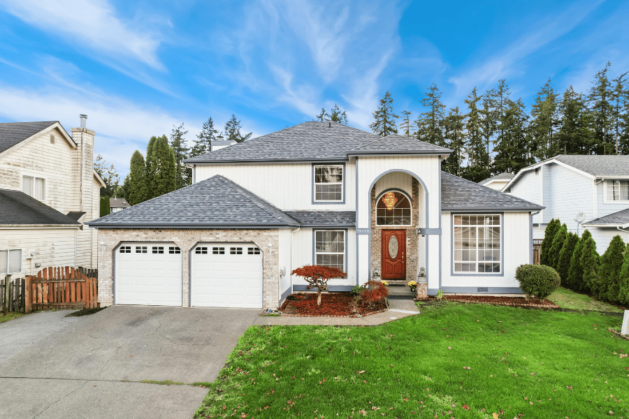 Two story white exterior two car front facing garage