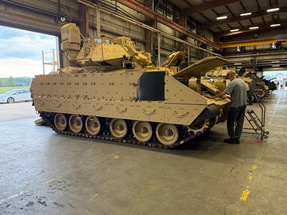 Red River Army Depot tank and mechanic in hangar
