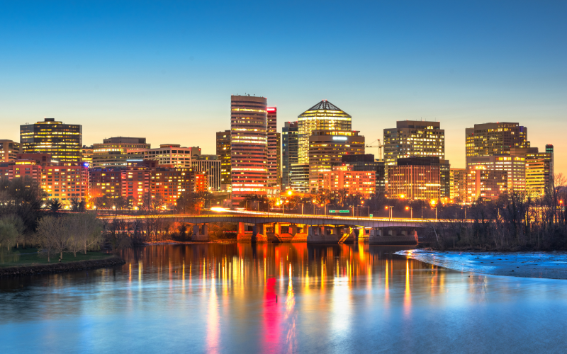 Rosslyn, Arlington, Virgina city skyline at dusk on the Potomac River, reflection of lighted buildings on water
