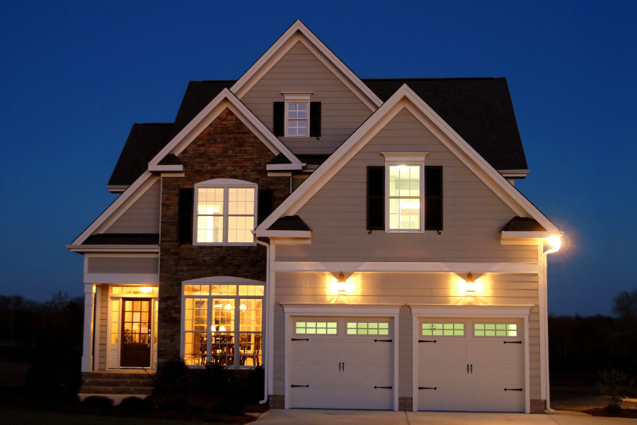 Two_Story_Home_with interior lights on at night