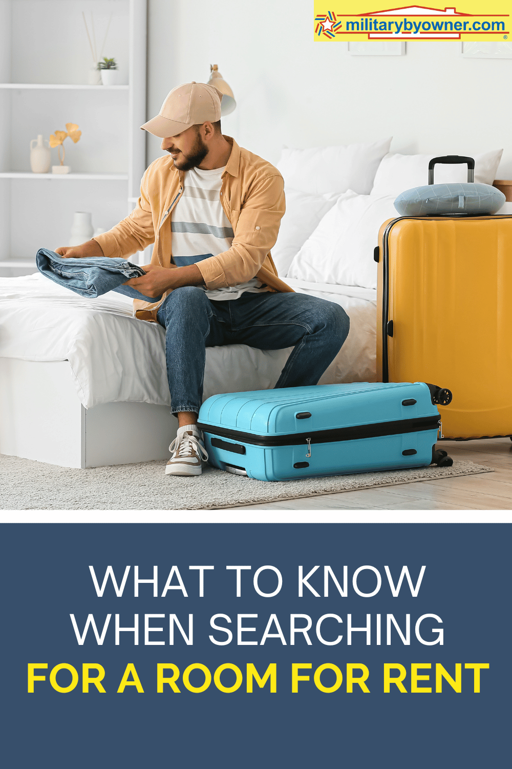 Man in ball cap and yellow button down sits on bed with folded jeans in hand with bright blue and yellow suitcases in white room and text, What to Know When Searching for a Room for Rent