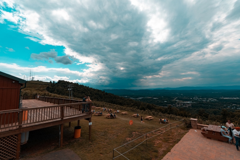 view of hill, picnic tables, cloudy sky in Virginia