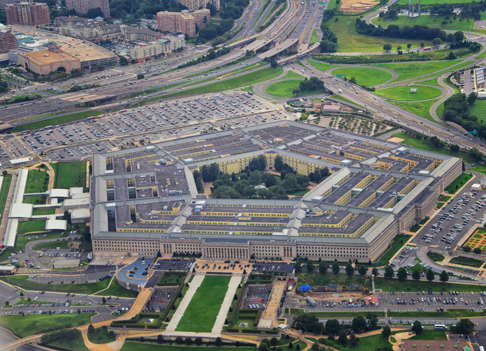 aerial view of the Pentagon in DC with bright green grass surrounding the building.
