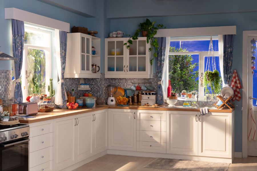 kitchen with white cabinets and blue walls